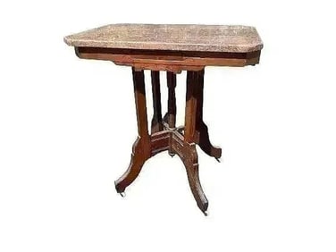 A Victorian Walnut Table with Marble Top