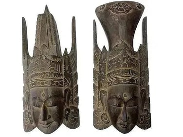 Pair of old Indonesian hand carved deity masks