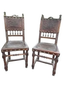 Pair of Antique Spanish chairs with embossed dragon emblems