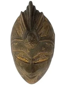 A hand carved Java Batik wooden mask