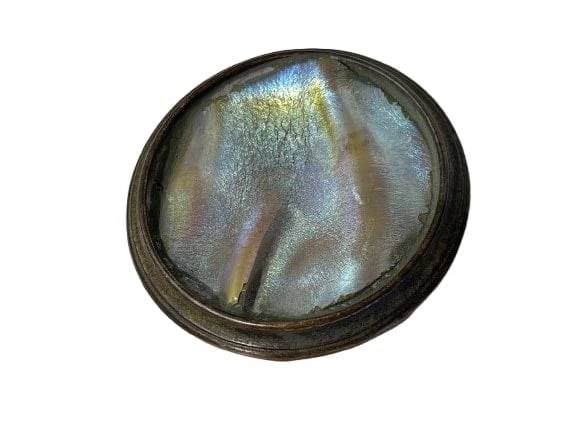 A Tiffany Studios round paper weight: A Tiffany Studios Bronze & Turtleback glass Paperweight.A Tiffany Studios round paper weight measuring 2 inch 7/8 in diameter. A unique and rare Tiffany paper weight with an Iridescent turtle back gla