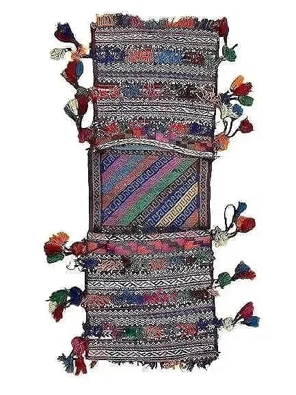 A Balouch hand woven Saddle bag: An old Afghan Balouch hand woven Saddle bag measuring 34 inches long by 13 inches long.