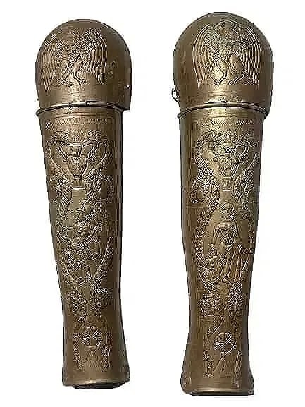 Old European Knights Greaves Armor Pair of Metal Knee & Shin Guards: Old European Knights Greaves Armor Pair or Old Brass Metal Knee & Shin Guards.Measuring 23 inches long each. Pair of Roman knights style brass Knee & calf shin guards. Unique pair of collectible