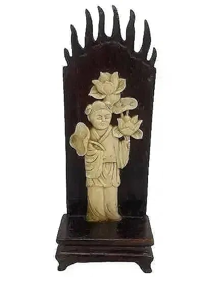 Antique Asian carved wood decorative stand: Antique Asian hand carved wood decorative stand. A hand carved wood stand with a flame design & a hand carved Boy measuring 5 1/4 inches tall.