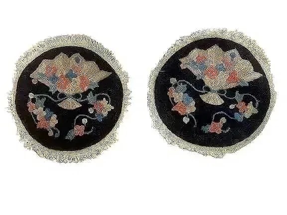 Pair of antique Chinese round rug samplers: Pair of antique Chinese round Peking rug samplers. Each round rug measures 12 inches in diameter.