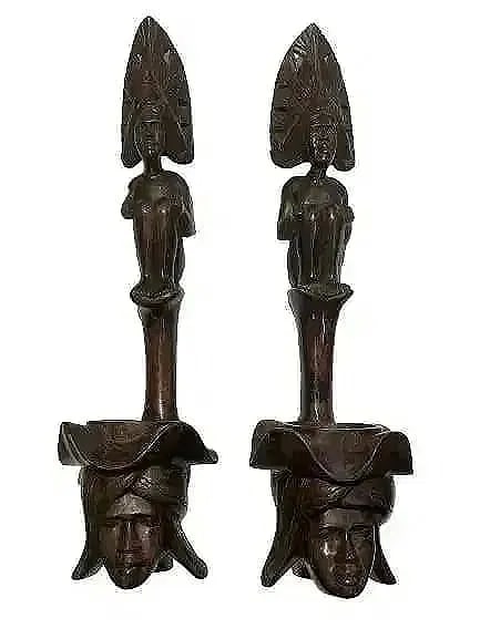 Pair of African Wood hand carved decorative statues: Pair of African Wood hand carved statues. Each measuring 24 inches tall and 7 inches wide. Unique decorative objects.