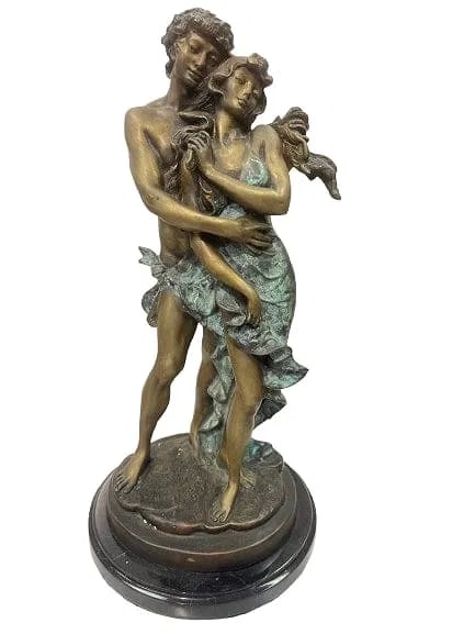 A vintage Bronze statue: A vintage Bronze statue of a young lovers embracing. A fine casting & patination bronze statue on a marble round base standing 14 inches tall including the base.SHIPPING: as courtesy to all of our