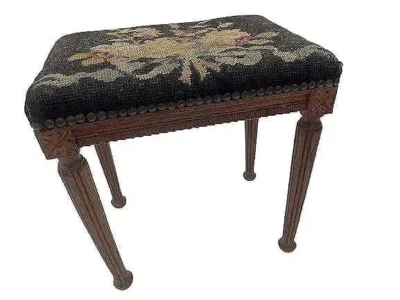 Antique tall Foot Stool: Antique tall Foot Stool measuring 14 1/2 high x 10 1/2 inches wide x 14 1/2 inches long. A charming foot stool with tall legs and needle point seat cover.