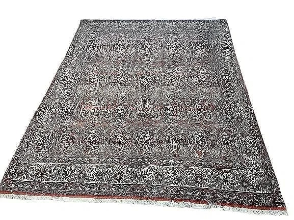 A Persian Bijar hand woven wool rug: A Persian Bijar hand woven wool rug measuring 6 feet 8 inches by 8 feet 5 inches long. A finely woven Genuine Persian Kurdish Bijar wool rug. A highly intricate floral all over design.