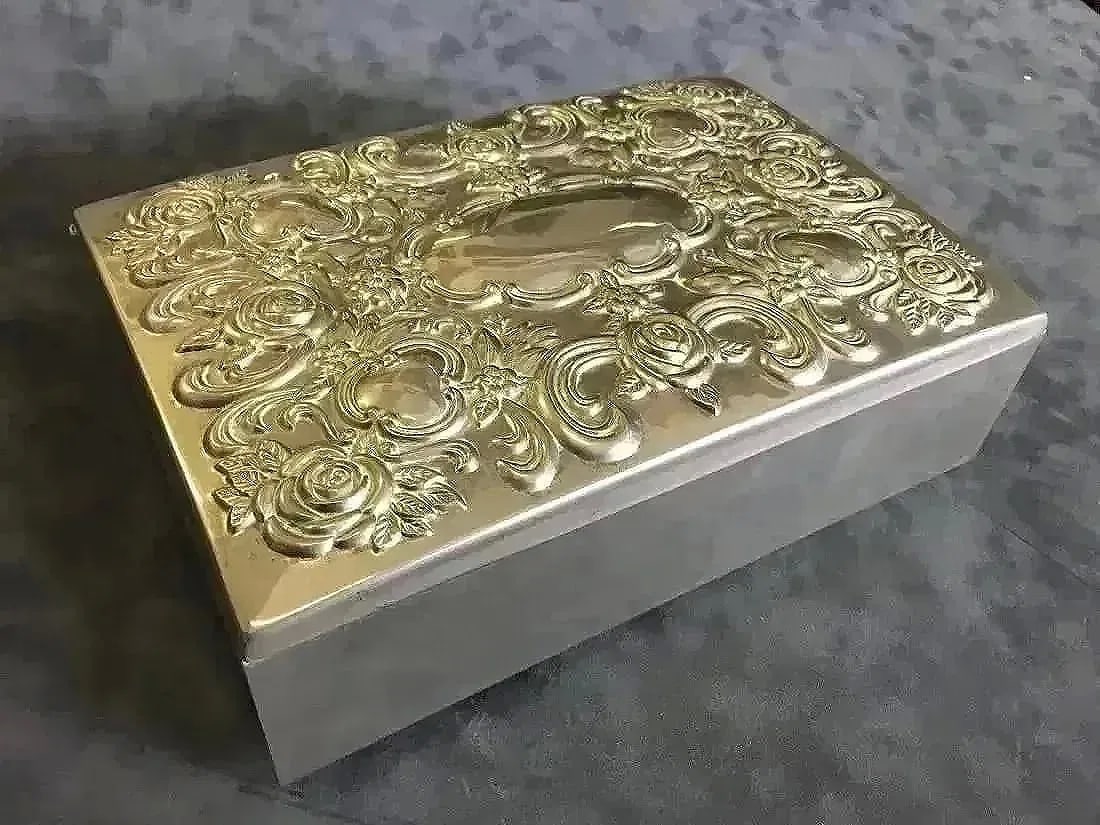 A plated Jewelry box by Godinger: A plated Jewelry box stamped by Godinger. a nice box with swirl, flower and lattice pattern. dimensions : 10" inches long , 7" inches wide, 3" inches Height.