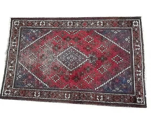 An old Persian Josheghan Hand woven rug: An old Persian Josheghan Hand woven wool rug Measuring 4 ft 5 inches wide by 7 ft 1 inches long. A tribal persian jsheghan snow flake design scatter rug.
