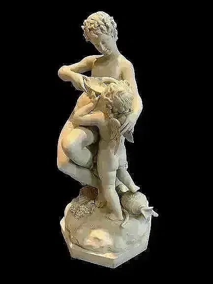 A fine European bisque porcelain statue: A fine bisque porcelain ,subject of a young man giving water to a Cherub. Unknown artist, stamped 1284 in the back with a matte appearance and texture to the touch. 19 inches tall.