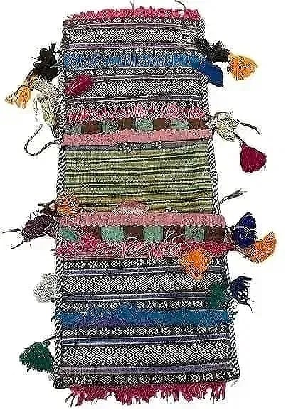 A Balouch hand woven Saddle bag: An old Afghan Balouch hand woven Saddle bag measuring 29 inches long by 12 inches long.