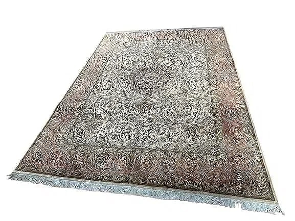 A Persian Tabriz Fine large room size rug 10 by 13: A Persian Tabriz Fine large room size rug 10 feet wide by 13 feet long. A finely woven used Persian Tabriz wool & silk highlighted rug with a cotton foundation. An intricate floral design with a cente