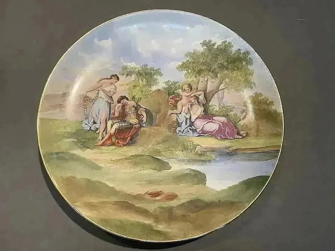 Austrian Porcelain charger plate Signed: A fine hand painted porcelain charger Signed Kaufmann. Possibly after Angelica Kauffman's Paintings Venus and Mars + Cupid Binding Aglaia of Austria. dimensions : 13" 1/2 inches in diameter.