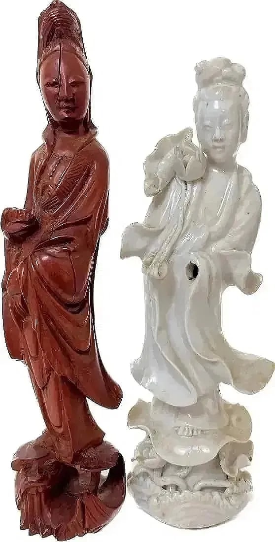 Two Asian Diety Figurines: Two Asian Diety Figurines.Brown wood figurine size is 8 in H x 1.5 in W. White ceramic figurine size is 7 in H x 2 in W.