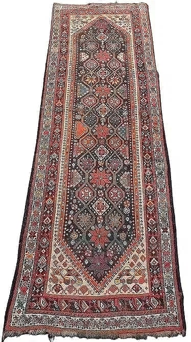 Antique Persian Kurdish Qashquai handwoven tribal runner: Antique Persian Kurdish Qashquai handwoven tribal runner. A wool on wool hand woven tribal runner rug measuring 3 feet 8 inches wide by 11 feet long. A highly decorative antique wool rug.