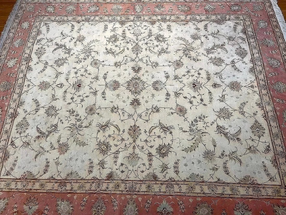 Persian Tabriz wool & silk rug: A persian Tabriz handwoven wool & silk rug measuring 8 feet 1 inch wide by 9 feet 8 inches long. A finely woven genuine Persian Tabriz used all over design rug.