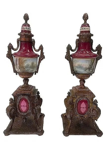 Pair of Antique French Sevre porcelain mounted urns: Pair of Antique French Sevre porcelain mounted urns with copper mounting and base. Hand painted with swans on a lake. Each earn standing about 15 inches tall.