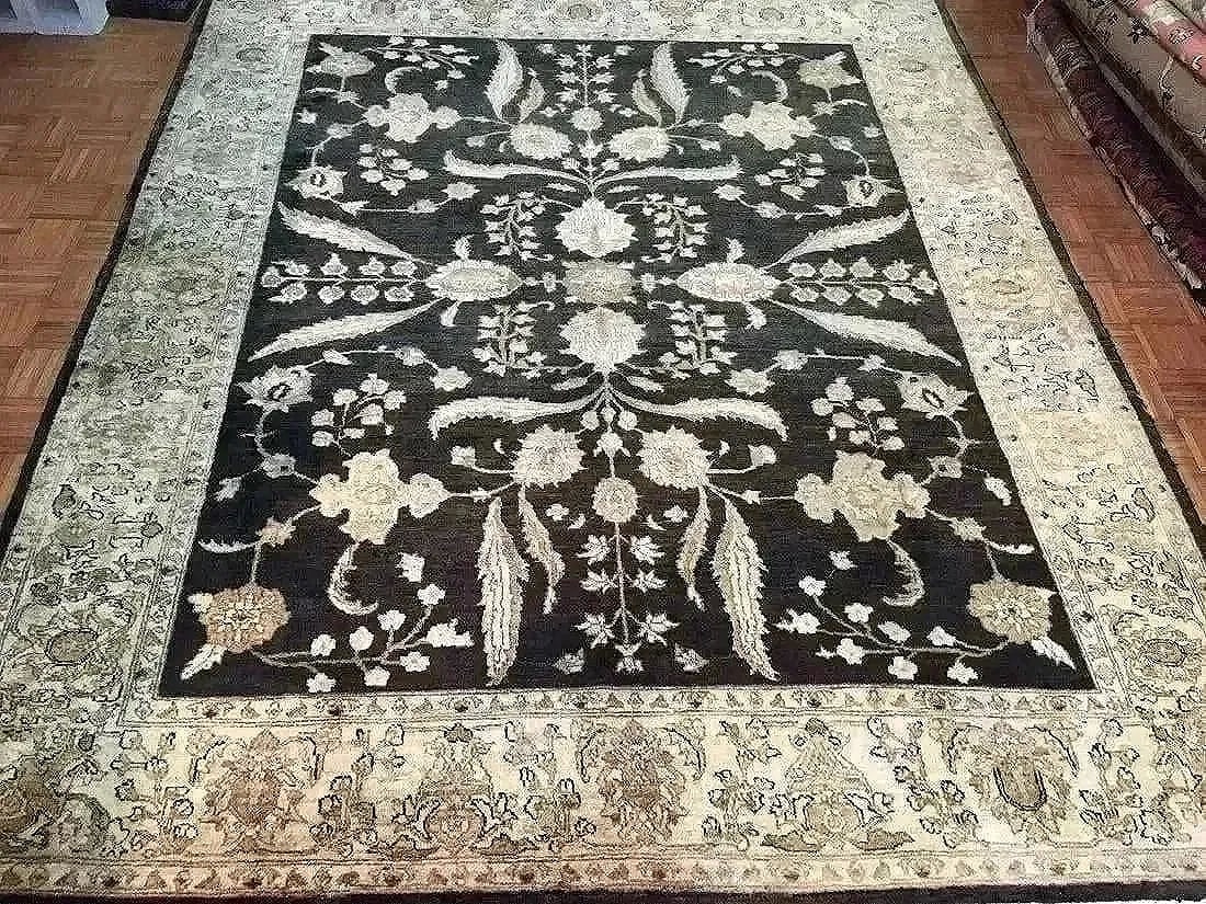 A handwoven Pakistan Chobi wool rug: A hand woven fine Pakistan Chobi wool rug. Measuring 8 ft wide by 10 feet long.