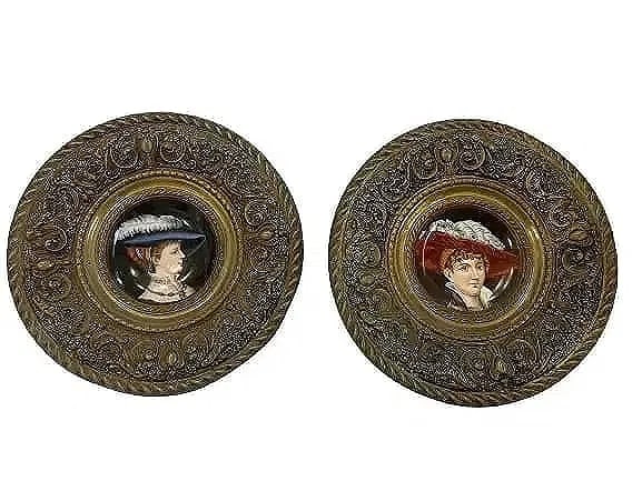 Pair of German porcelain plate display chargers: Pair of German porcelain plate display chargers. A beautiful set of portrait charger porcelain plates housed in ornate round metal display frames. Each frame measuring about 16 inches in diameter and