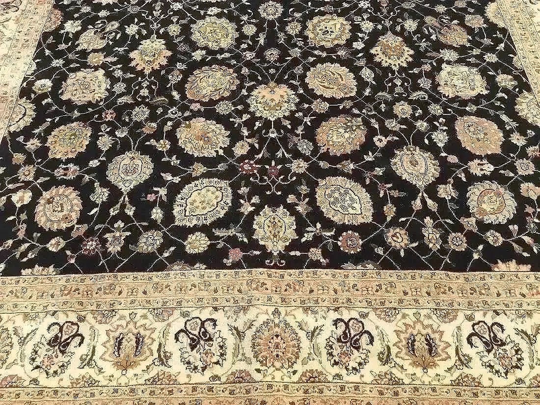 A handwoven Tabriz design rug: A handwoven Tabriz design rug measuring 8 ft 7 inches wide by 11 ft 8 inches long. Hand knotted in China with Pure wool pile.