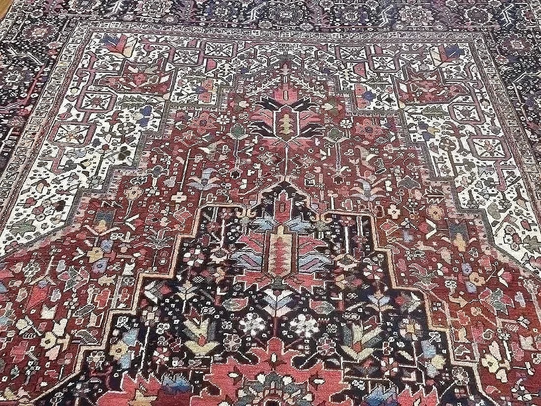 Antique Persian Heriz handwoven rug: Antique Persian Heriz handwoven rug measuring 9 feet 4 inches wide by 12 feet 6 inches long.