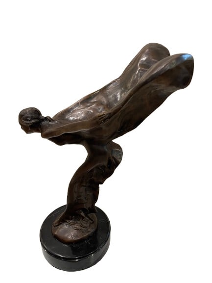 Spirit of Ecstasy Bronze Sculpture on Marble Base – After Charles Sykes: Spirit of Ecstasy Bronze Sculpture on a Marble Base – After Charles Sykes Standing 21 inches tall. A rolls Royce spirit of ecstasy signed Charles Sykes.The Spirit of Ecstasy Sculpture is a bonnet ma