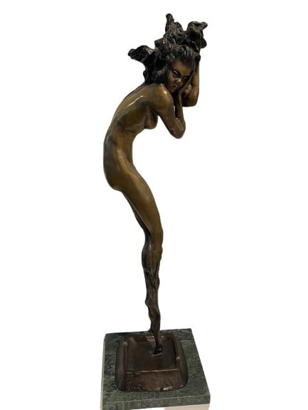 A bronze tall Louis Icart statue of a nude female figure: A bronze tall Louis Icart statue of a nude female figure standing 24 inches tall with a 5 inch by 6 inch marble base.