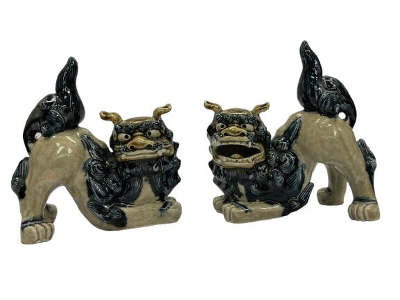 Pair of glazed Foo Dogs: Pair of glazed Foo Dogs each measuring 7 inches long and a bout 8 inches tall in the tails. A unique and charming pair of Foo Dogs.