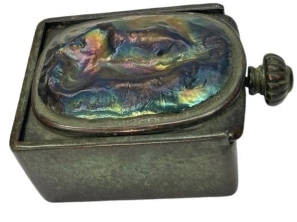 A Tiffany Studios bronze Jewelry box with a turtle back iridescent cover: A Tiffany Studios bronze Jewelry box with a turtle back iridescent cover. A rare heavy fireproof Tiffany studios jewelry box with a large screw on knob Stamped on the bottom TIFFANY STUDIOS NEW YORK i