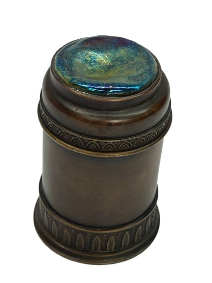 A Tiffany and Company Bronze Cylindrical Trinket box with a Turtle back cover: A rare Tiffany and Company Bronze Cylindrical Trinket box with a Turtle back cover. A very detailed leaf trimming design with a vibrant iridescent glass cover standing about 3 1/2 inches tall. Stamped
