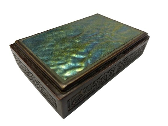 A Tiffany Studios # 2275 bronze trinket box with a turtle back iridescent Fevrille glass cover: A Tiffany Studios # 2275 bronze trinket or cigarette box with a turtle back iridescent Fevrille glass cover and cedar wood lining.A heavy & highly detailed cast floral or embossed floral & vine