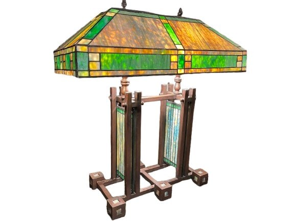 A Frank Lloyd Wright double pedestal style lamp: After Frank Lloyd Wright double pedestal lamp which was originally designed for the Dana-Thomas house in Springfield, Illinois.A highly decorative and rare design lamp Featuring a rectangular base, tw