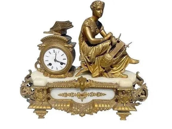 Antique French Mantel Clock: Antique French Mantel Clock. Measures 19 inches wide by 15 inches tall.