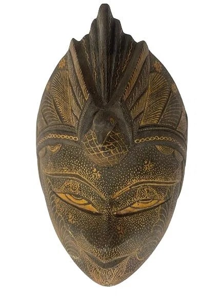 A hand carved Java Batik wooden mask: A hand carved Java Batik wooden mask.Hand carved and hand painted Panji Semirang Indonesian prince of epic poetry masks. Highly detailed hand painted tribal decorative wooden masks. the mask measures