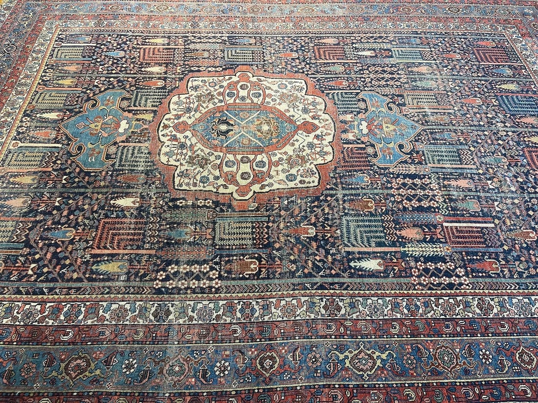 Antique Persian Bijar room size rug: Antique Persian Bijar room size rug measuring 9 feet 5 inches wide by 12 feet 6 inches long. A well executed Weeping willow tree design flanked by a kings saddle design medallion resting on navy field