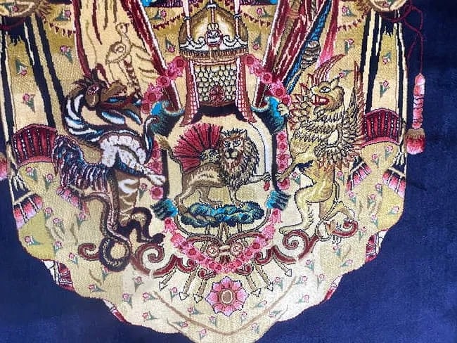 A small square silk rug - 11