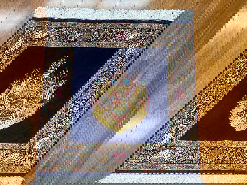 A small square silk rug - 13