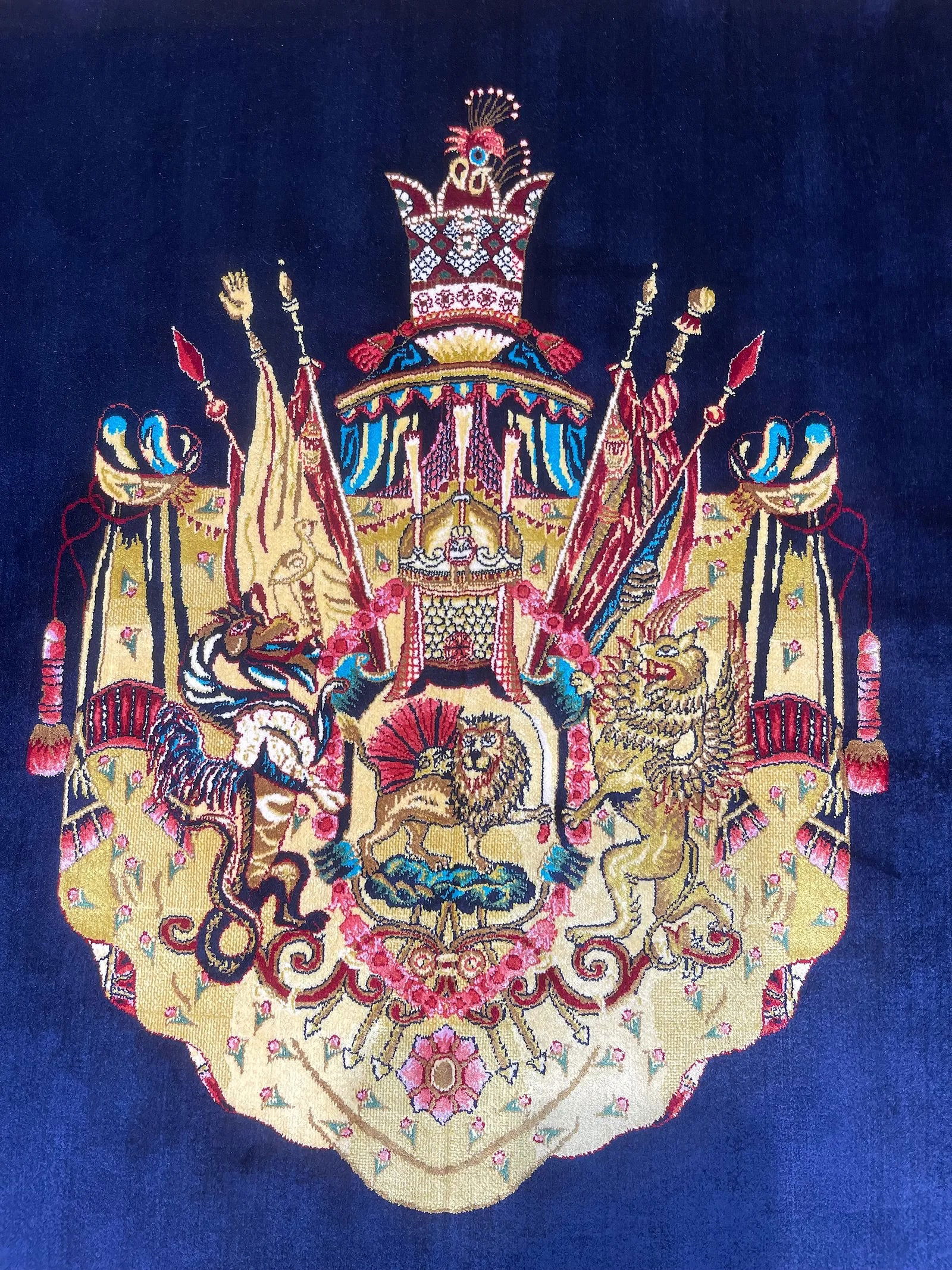 A small square silk rug - 2