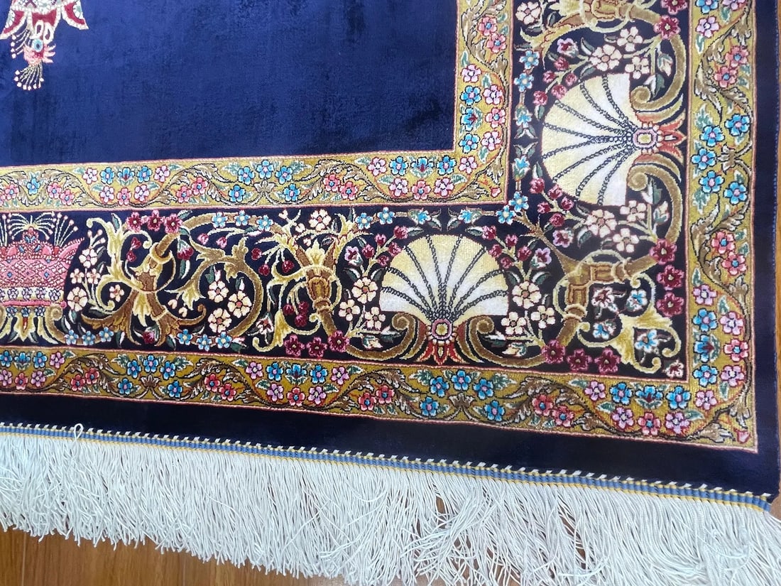 A small square silk rug - 9