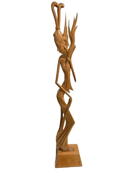 A large hand carved Balinese statue: A large hand carved Balinese statue standing 33 1/2 inches tall by 6 1/2 inches wide. A unique female Balinese dancer statue.Stamped to the base and dated.