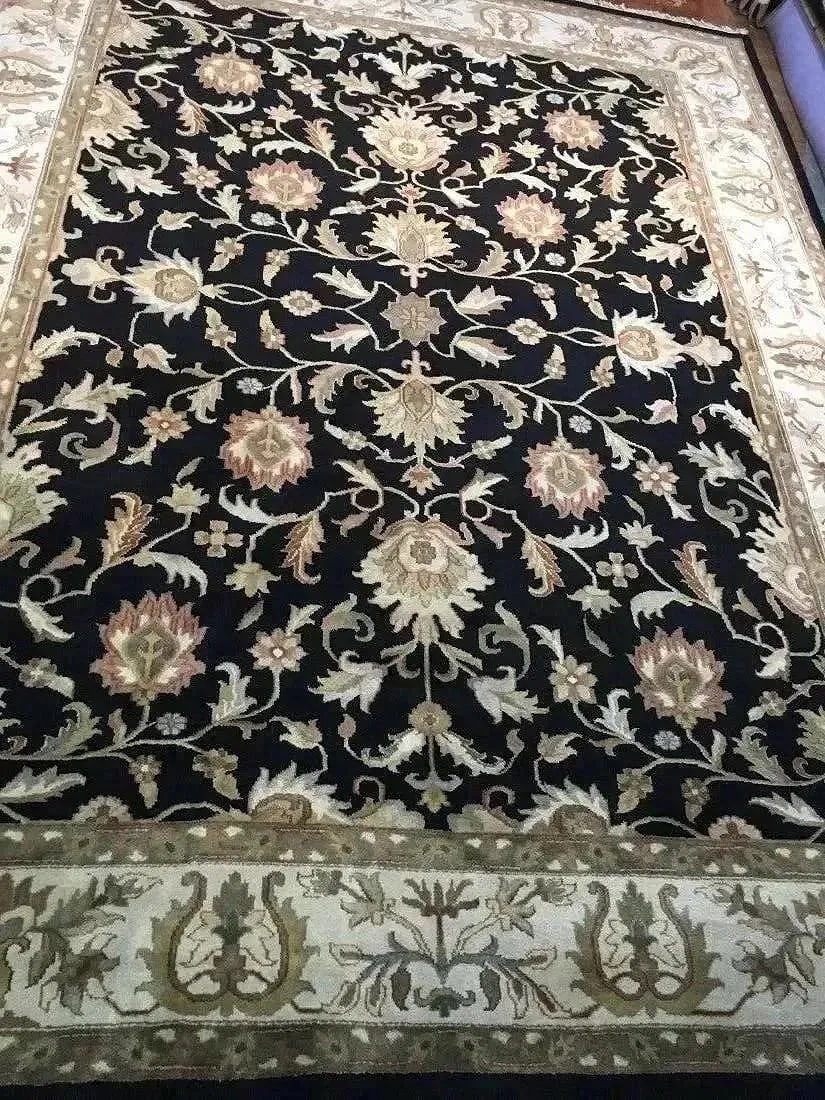A handwoven Indian Kashan wool Rug: A hand woven Indian Kashan wool Rug. Measuring 9 ft wide by 12 ft long.