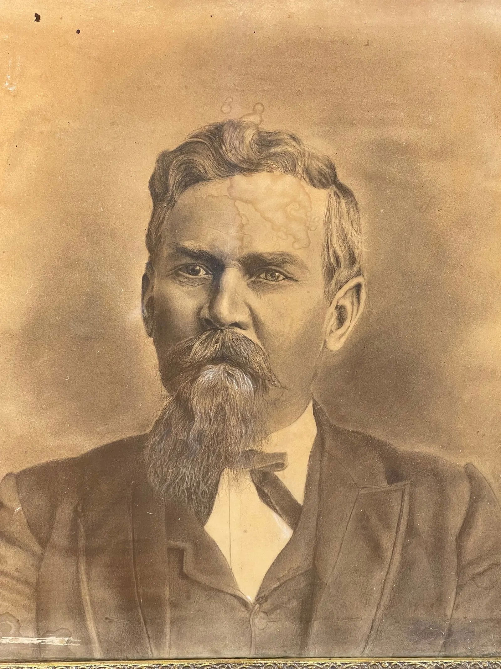 Antique Charcoal & pastel portrait of a gentleman: Antique Charcoal & pastel portrait of a gentleman on paper laid on canvas. Sight measures 22 inches wide by 24 1/4 inches long and the glass covered frame measuring 25 3/8 inches wide by 28 inches lon