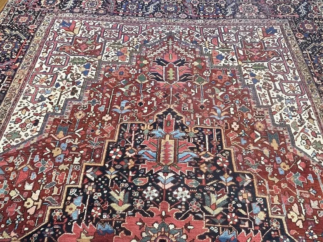 Antique Persian Heriz handwoven rug: Antique Persian Heriz handwoven rug measuring 9 feet 4 inches wide by 12 feet 6 inches long.