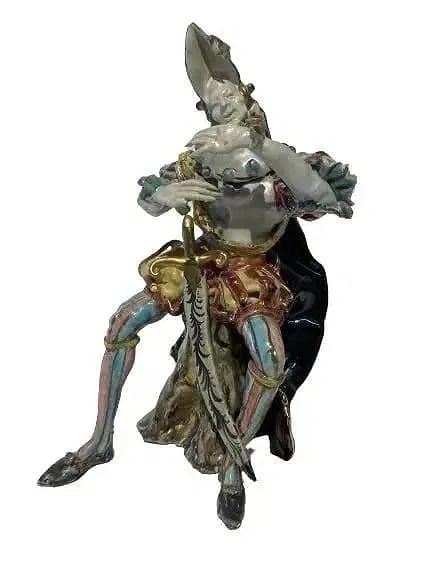 A Porcelain Focke & Meltzer Amsterdam figurine: A Porcelain Focke & Meltzer Amsterdam figurine soldier. A 16th century style porcelain soldier with a sword. Measures 9 inches tall. Very detailed finish decorative porcelain statue.