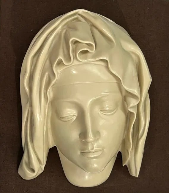 Head of Virgin Mary after Michelangelo Pieta sculpture: A Virgin Mary head after Michelangelo's Pietà sculpture in St. Peter's Basilica.Made in the 1980s under authorization from the Vatican Museums and the Metropolitan Museum of Art, often sold as a