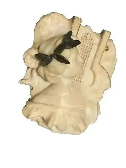 Antique Marble bust of a young lady: Antique Marble bust of a young lady measuring 17 inches by 17 inches by 8 inched thick. A European Hand carved bust with great degree of detail.