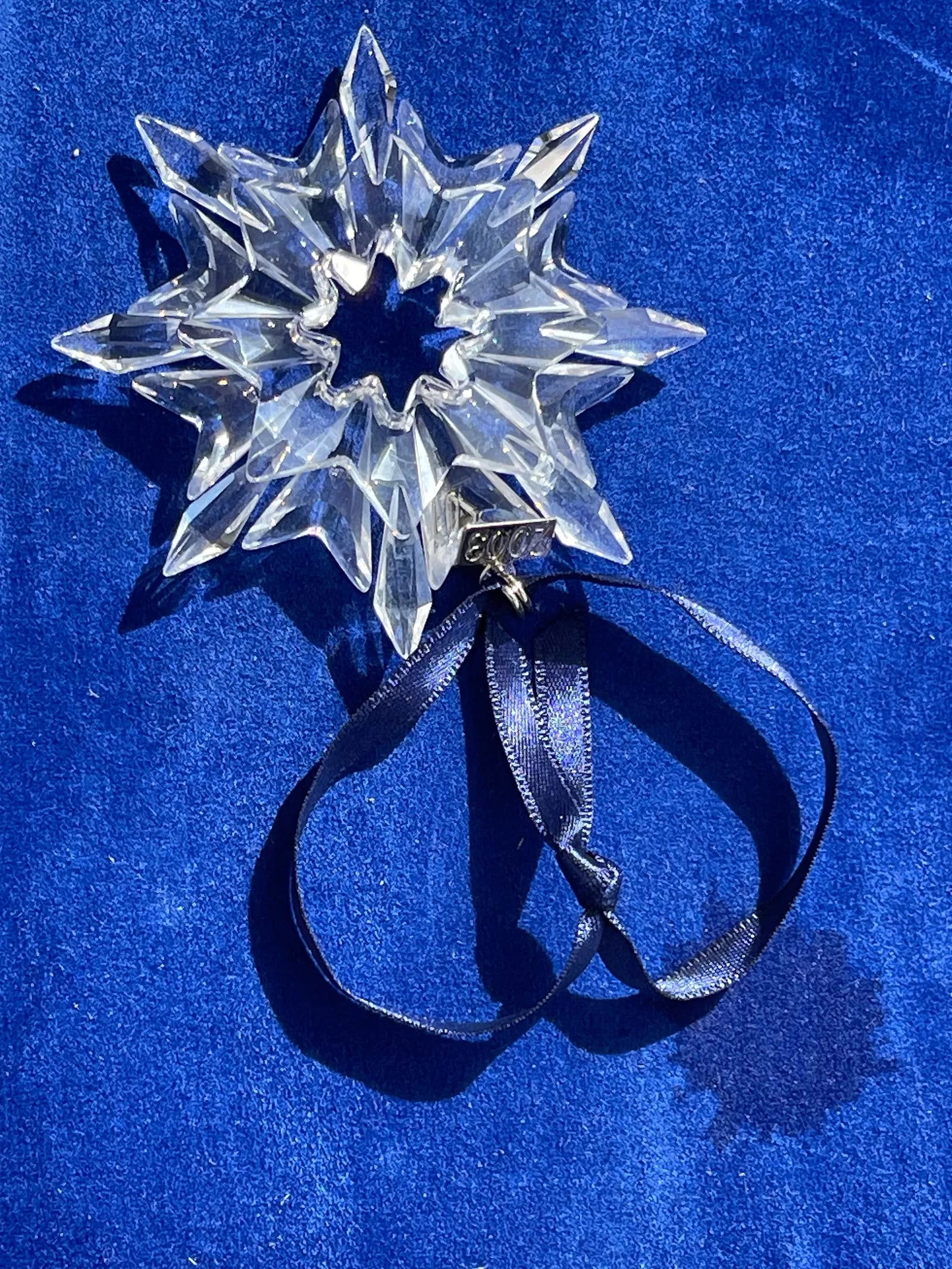 A SWAROVSKI Crystal Christmas Ornament 2003: A SWAROVSKI Crystal 2003 Christmas Ornament made in Austria. Comes with the original triangle box.