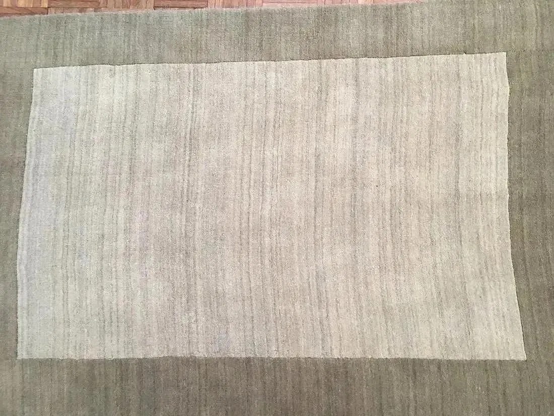 A Hand tufted contemporary Rug: A Hand tufted contemporary Rug. Size 3 ft 8 inches wide by 5 ft 3 inches long.